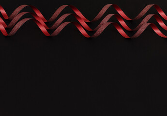 Decorative ribbon on a black background.