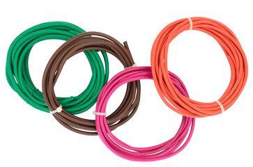 Naklejka premium Top view of rolled cables isolated on white