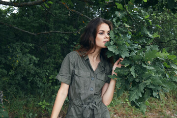 Portrait of a woman Green leaves near the tree face fresh air