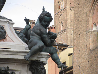 Closeup of putto adorning the fountain of Neptune in Piazza del Nettuno next to Piazza Maggiore, Bologna Italy