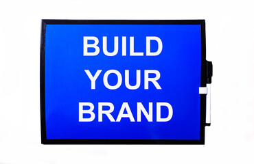 On a blue background a white inscription BUILD YOUR BRAND