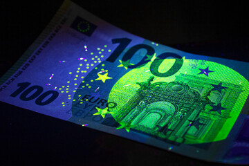 100 hundred Euro currency in UV light protection.Euro in UV light.Euro currency in UV light protection.