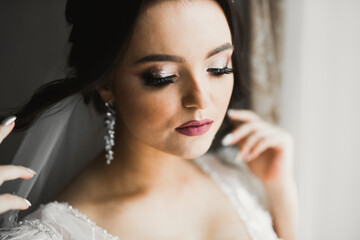 Portrait of a beautiful fashion bride, sweet and sensual. Wedding make up and hair