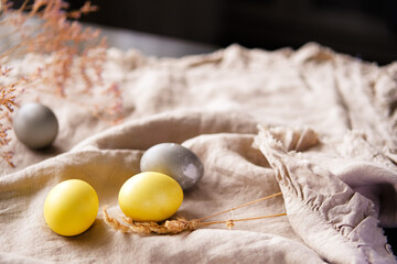 Organic naturally dyed yellow and gray Easter eggs.