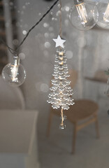 New Year's garland in the form of a Christmas tree with fanlights. Home decor for New Year