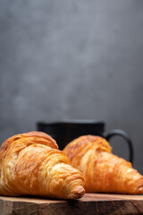 Delicious snack croissant on black background