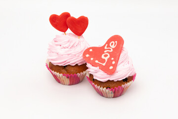 Valentine's Day. Cupcakes with hearts on a white background for Valentine's Day.