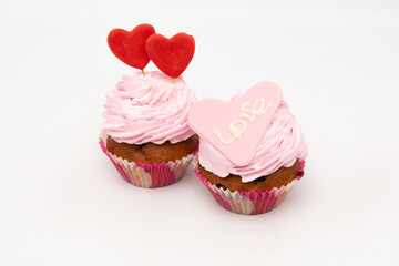 Valentine's Day. Cupcakes with hearts on a white background for Valentine's Day.