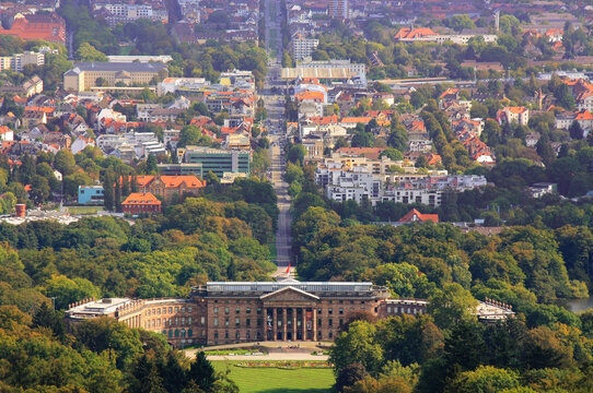 A telephoto shot from the Mountain Park in Kassel. In the middle is the Wilhelmshöhe Palace and in the background the cityscape with the train station at the top of the picture.