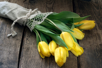 bunch of yellow flowers on wooden background