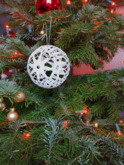 Crafts hung on the Christmas tree. Crochet Christmas ball.