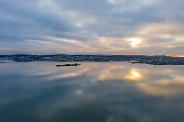 Windless sea in winter evening drone photo