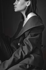 Beautiful young woman in black suit © soup studio