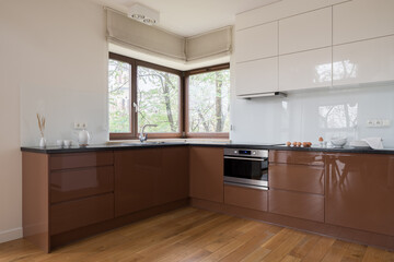 Kitchen with brown and white furniture