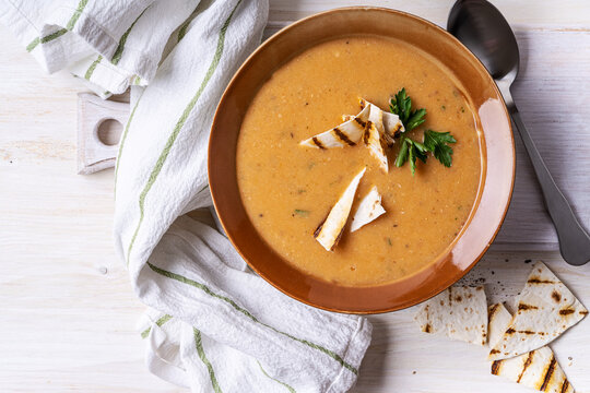 Bowl Of Bean Soup, Pita Bread On White Wood, Healthy Vegan Meal