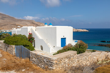 View of the white villa with blue shutters, Folegandros Island, Greece.