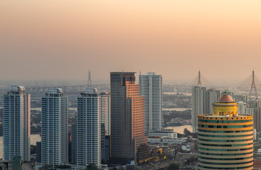 Bangkok, Thailand - Jan 12, 2021 : Aerial view of Beautiful scenery view of Skyscraper Evening time before Sunset creates relaxing feeling for the rest of the day. Selective focus.