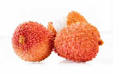 fresh lychees on a white background