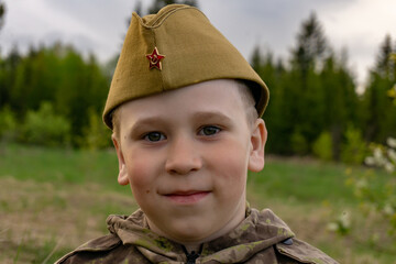 Portrait of a boy in a military uniform. Victory Day. 9th May.