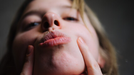 a girls lips up close. A girls face up close