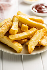 Big french fries. Fried potato chips.