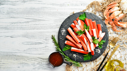 Crab sticks with spices on a plate. Cooking salad. Rustic style. Seafood delicacies. © Yaruniv-Studio