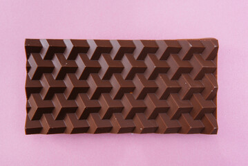 Natural handmade chocolate close-up on a bright background.