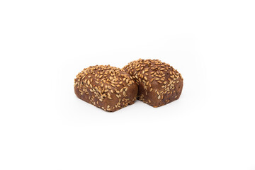 Bread. A whole loaf of bread with seeds on a white background .