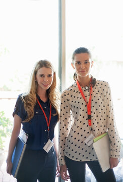 Confident Entrepreneur Wearing Visitor Lanyard Standing At Office