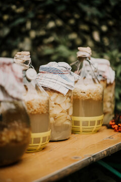 Variety of pickle jar on table outdoors