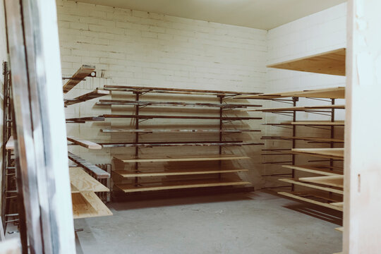 Planks in shelf at workshop