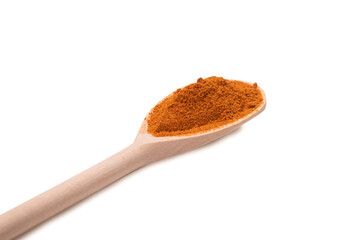 Paprica on wooden spoon isolated.