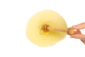 Dipper with honey in woman hand. Space for text or design.