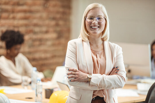 Group of young multiracial business people are working in modern office. Freelancers in coworking place. Creative and stylish youth. Successful young business woman