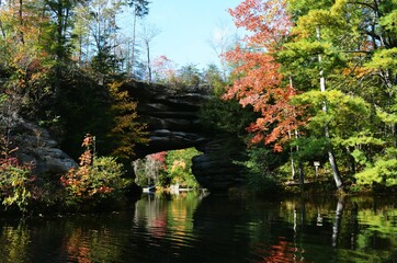 Natural Bridge at a lake in the fall