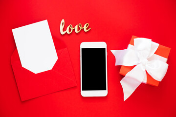 Mock up of Smartphone and Greeting card in envelope. Template for Valentine's day or Mother's Day.