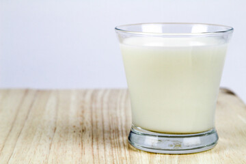 Little glass of milk on the table