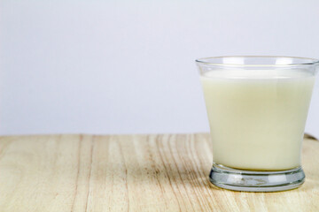 Little glass of milk on the table
