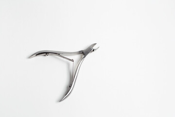 Close-up of cuticle cutters on white background.