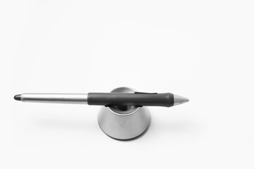 Close-up of stylus pen for graphic tablet on white background.