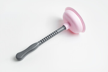 Top view of grey pink plunger on white background.