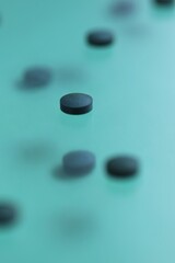  Spirulina algae tablets.Dietary supplements. Spirulina pills set on a turquoise background.Super food. Healthy organic seaweed.Healthy lifestyle.  algae tablets