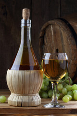 Still life with white wine and grapes