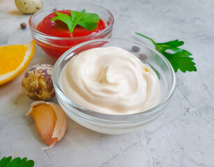 ketchup, mayonnaise, quail eggs on a concrete background