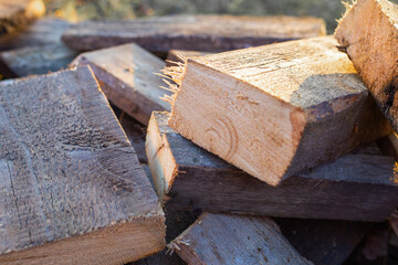 saw cut from a pine board. Preparation of firewood for the winter