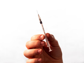 close up photo of white empty syringe in male hand
