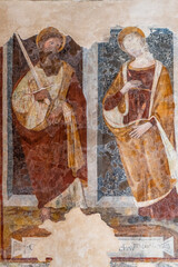 16th-century frescoes depicting Saint Paul and presumably Saint Catherine, inside the tiny medieval church of Santa Croce, in Populonia, municipality of Piombino, Province of Livorno, Tuscany, Italy