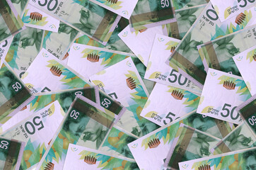 50 Israeli new shekels bills lies in big pile. Rich life conceptual background