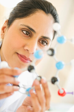 Scientist Holding Molecular Model