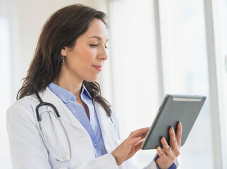 Female doctor using digital tablet